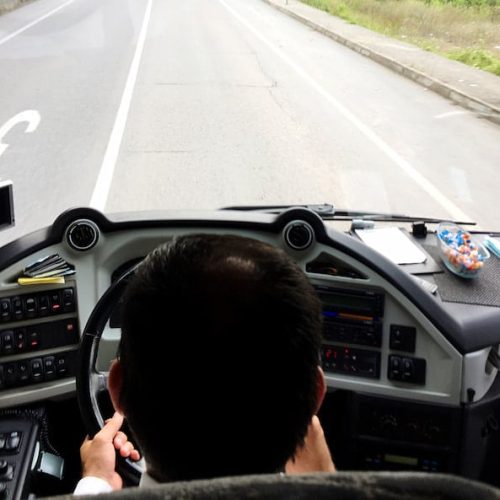 high-angle-view-man-riding-car-road (1)